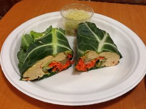 Raw vegan/GF collard wrap (homemade cashew cheese, spinach, and carrots) with a side of raw vegan, GF pesto kelp noodles. at Superfoods Cafe & Market in Mt Airy