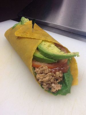 Raw vegan, GF Fiesta wrap on a raw vegan, GF turmeric coconut paleo wrap.  at Superfoods Cafe & Market in Mt Airy