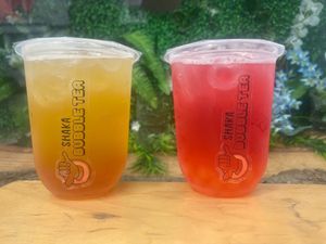 Pineapple fruit tea with pineapple boba. Raspberry fruit tea with raspberry boba. at Shaka Bubble Tea in Llandudno