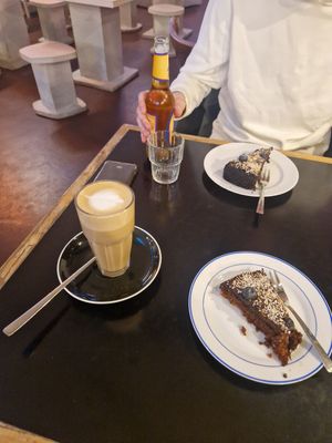 Oat latte and a vegan cinnamon cake at The Source in Berlin