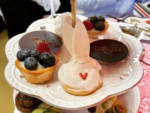 Sweet bites including bunny cream puffs, chocolate ganache and berry tarts .  at Queen of Hearts in Henderson