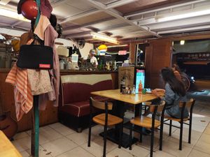 Kitchen with owner behind counter at  夏太熱 Summer Too Hot Pizzatopia in Hualien