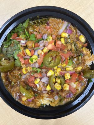 Rice bowl with a mix of chana, spinach and lentils, and various toppings   at The Twist Indian Grill in Dayton