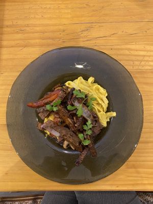 Pasta a la huancaina with lomo saltado  at Lounge del Brujo Centro Histórico in Arequipa