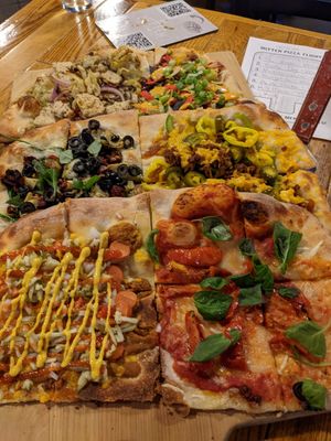 Vegan pizza flight! at The Mitten Brewing Co in Grand Rapids