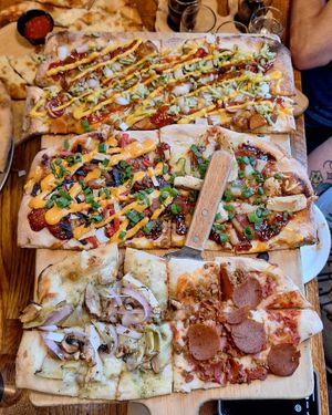 Vegan pizza flight. Hog Heaven, Westerdog, Da Meat Hook, Pesto Chicken, and Aloha BBQ. at The Mitten Brewing Co in Grand Rapids