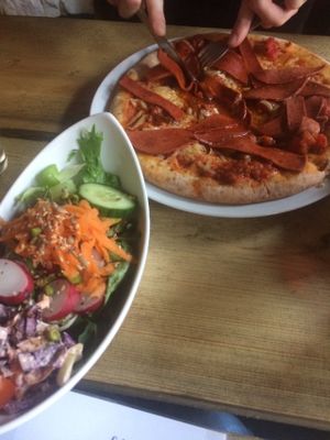 Pepperoni pizza with salad at Duke Bullock's Vegan Cafe in Scarborough