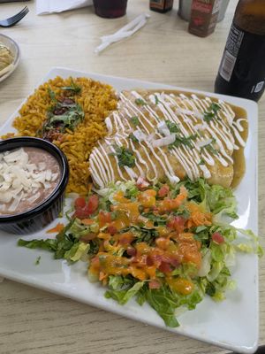 Three enchilada platter with rice, beans, and salad at Sol Of Mexico in Worcester