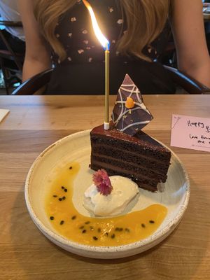 Passion Fruit Sachertorte, Chantilly, Apricot Passion Mendiant (our waitress added a candle and a birthday note after spotting me giving my wife a birthday card earlier on!)  at Mallow - Canary Wharf in East London
