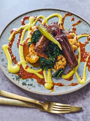 pimento sosis, persian lime cauliflower potato brasato, winter greens, apricot harissa, saffron borani at Mallow - Canary Wharf in East London