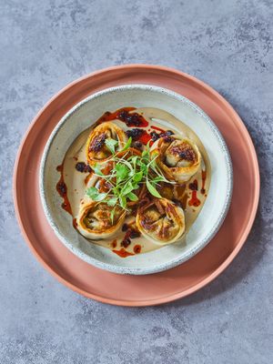 son dumplings, chilli oil, goma dare, hot & sour daikon pickle at Mallow - Canary Wharf in East London