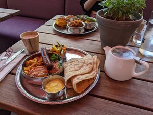 Menemen meze and frankie massala with a chai latte at Mallow - Canary Wharf in East London