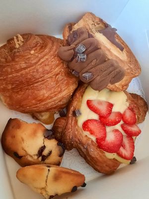Ham and cheese croissant, supreme roll, strawberry custard, chocolate chip madeleine at TheDorkyFrench Vegan Bakery in Glasgow