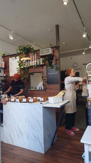 Behind the counter the kitchen with 3 marvellous women doing the food of the gods, thank you at TheDorkyFrench Vegan Bakery in Glasgow
