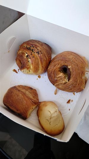 Sausage roll, no ham and cheeze roll, madeleine, mini pain au chocolat at TheDorkyFrench Vegan Bakery in Glasgow