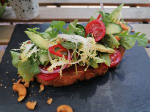 Slice with peanut spread, avocado, spicy cashews, delicious!! at Eight in Groningen in Groningen
