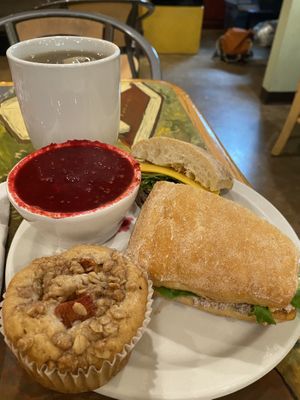 Vegetable gazpacho, with a vegan chicken sandwich, gunpowder green tea, and a vegan peach muffin. So good!  at Webster's Cafe in State College
