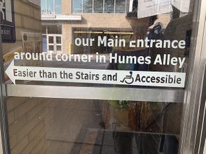 Two entrances: one is basement accessible, the other is via stairs  at Webster's Cafe in State College