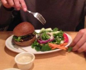mushroom burger and vegan salad dressing at Om Cafe in Ferndale