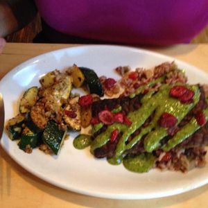 vegan pesto over baked tempeh and wild rice. side of veggies at Om Cafe in Ferndale