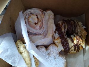 Whoopie pie or cookie sandwich, huge cinnamon roll, samona donut, powdered monkey foot pastry at Sweet Theory Baking Co. in Jacksonville