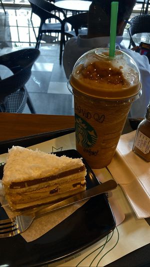 Mocha coconut cake and espresso Frappuccino with almond milk. Delicious  at Starbucks in Penang