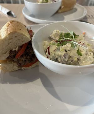 Philly Cheesesteak with a side of potato salad   at Stillfood Bistro & Cappuccino Bar in Penticton