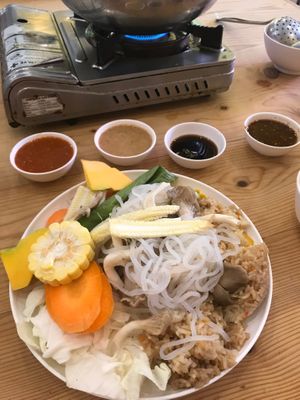 Turned into a great rice, noodles and mushroom veggie plate, with soy sauce and peanut sauce to add as your option at Kinn's The Buta in Udon Thani