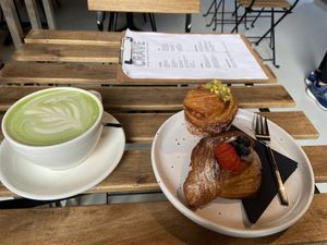Matcha latte with pea mylk (good), pistachio cruffin (good, but filling was a bit watery) and Lemon curd danish (good, but filling was a bit watery). at Crave Coffee & Bakery in Rotterdam
