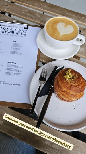 Latte and a pistachio cruffin at Crave Coffee & Bakery in Rotterdam