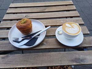 Pistachio cruffin and flat white, Crave Coffee Rotterdam, 20 June 2025 at Crave Coffee & Bakery in Rotterdam