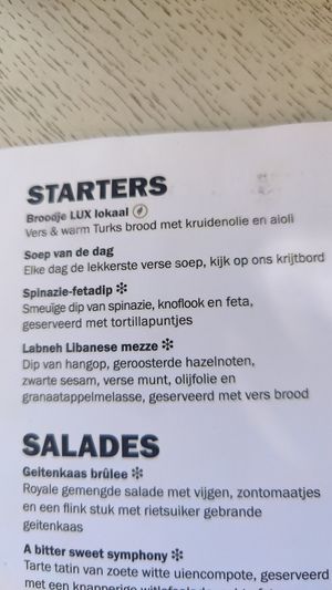 Menu with marked vegan options at Café Lux in Nijmegen
