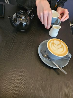 Pumpkin spice latte with oat milk and pot of tea with oat milk at Busk in York