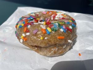 Vegan frosted sprinkle donut  at Sweet Crimes Gluten-Free Bakery in Washington