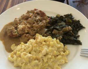 Country Fried Tofu, vegan mac, pickled greens at Southern Charm Kitchen in Gainesville