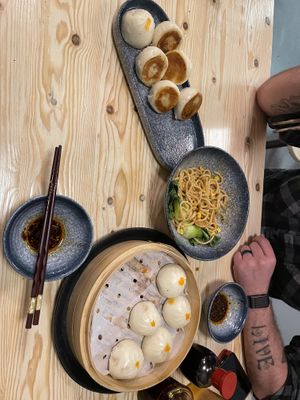 Water fried bao, noodles, and steamed bao partially eaten  at Chopstickers in Denver