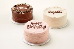 A petite 4", 2-layer cake that will serve 2-4 people, available in our vegan flavours. Personalize the writing on top (3 words max). Sorry, no other customization on these cuties! at Ooh La La Cupcakes in Victoria