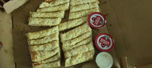 Vegan cheesy breadsticks w/vegan ranch at Toppers Pizza in Bloomington