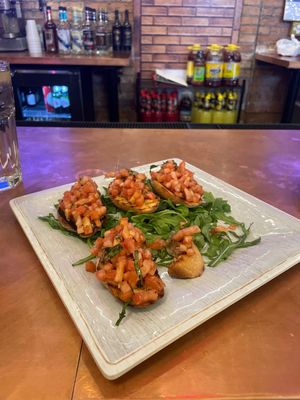 Disclaimer: the bruschetta comes with Romano cheese. They will not add it and now you have a delicious appetizer. ❤️  at Connie's Pizza in Chicago