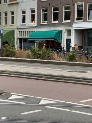 On a busy Central Amsterdam street  at Kailash Parbat in Amsterdam