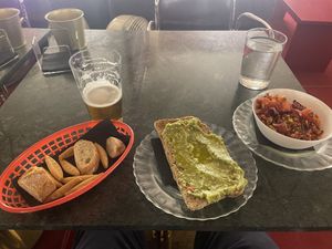 Vegan feta and avocado on bread and a lentil dish.   at La Sinsorga - Cultural Space in Bilbao