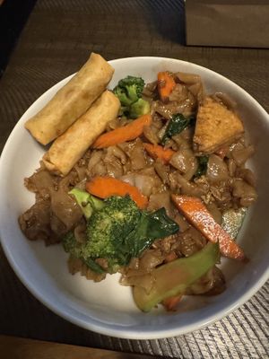 Pad See You with Tofu and a side of Crispy Rolls. So yummy and well seasoned, not too spicy but very flavorful  at BOONNOON Market in Arlington