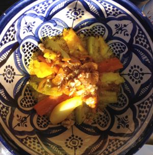 couscous topped with caramelised onion, raisins, potato, carrot, zucchini in a huge bowl at Arte y Sabor in Sevilla