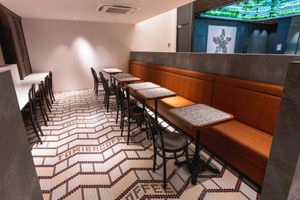 Back of the store has seating with benches. These seats are all equipped with power outlets to charge your phone or laptop. at Toriba Coffee in Tokyo