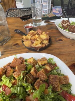 Schnitzel salad and crispy fries  at Lori Restaurant & Deli in Dominical