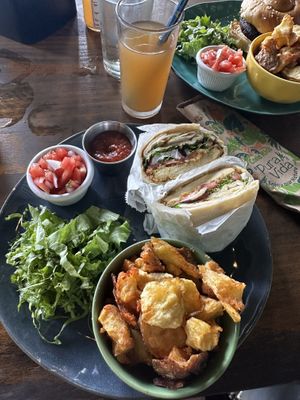 Home made Fries and tofu schnitzel in flatbread   at Lori Restaurant & Deli in Dominical