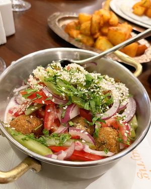 Fatteh Falafel with tahini, onion, pickles, tomatoes, fried bread, sesame, parsley. Note: ask to omit matsoni (milk product).  at Mayrig Yerevan in Yerevan