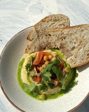 Hummus with cilantro and tomatoes at Kultura Diktuet in Astana
