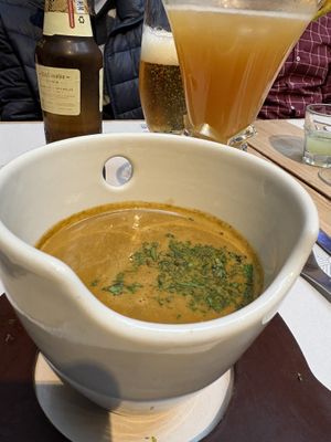 Lentil soup with tangerine & panela drink  at Artesano 81 by Crepes & Waffles in Cundinamarca