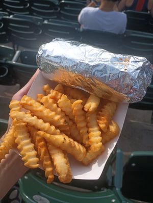 Big Dawg (in foil) and Slut Fries at Slutty Vegan - Truist Park Kiosk in Atlanta